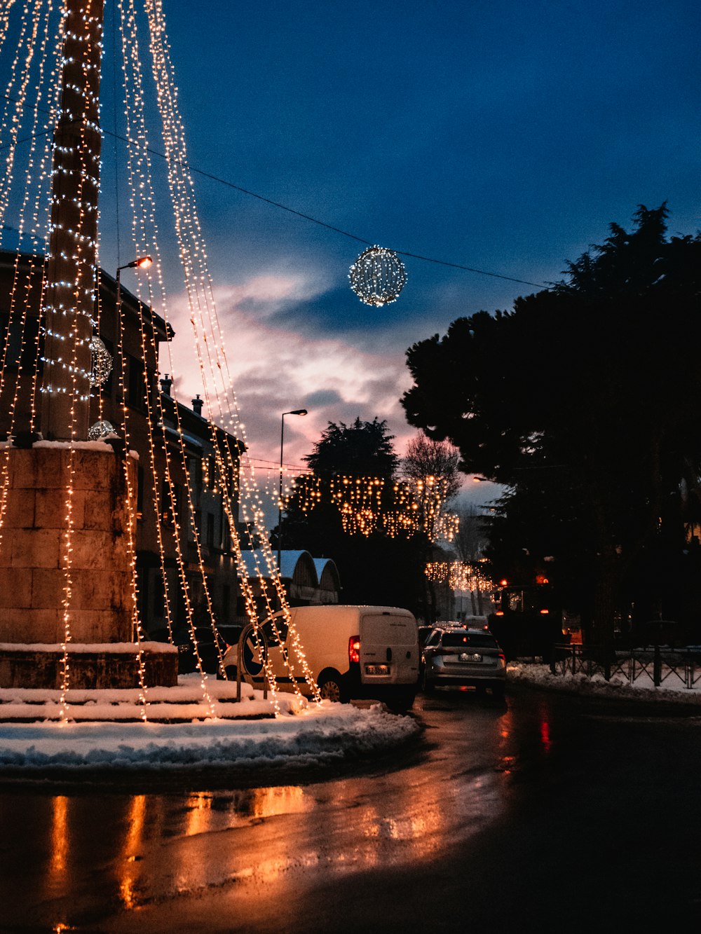 water fountain in front of brown concrete building during night time