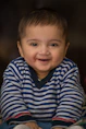 Vibrant baby photography capturing a candid, joyful expression.