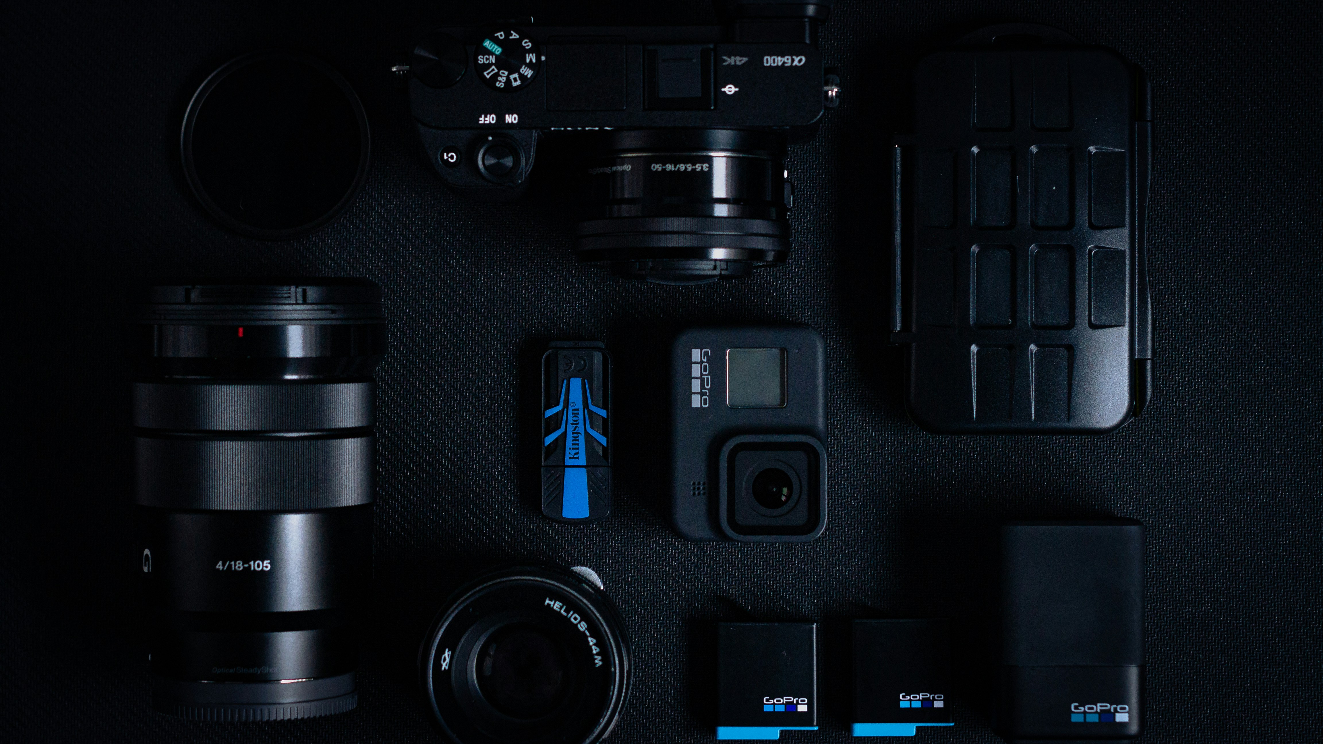 black dslr camera on black computer keyboard