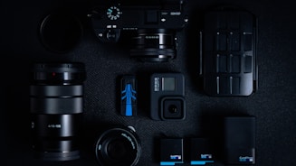 black dslr camera on black computer keyboard