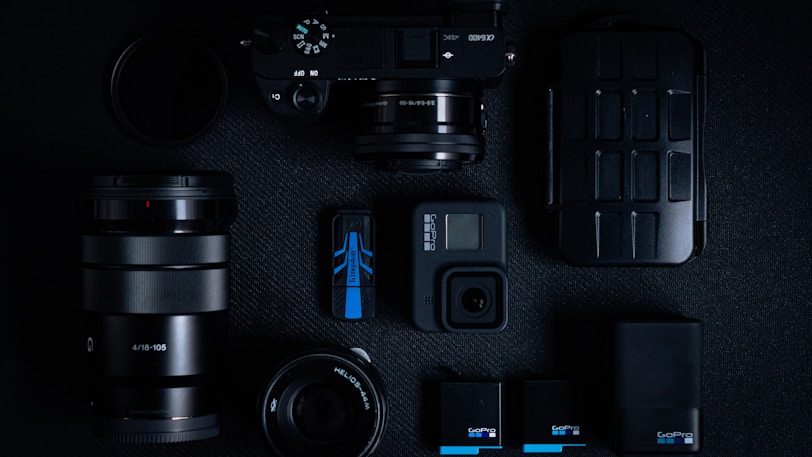 black dslr camera on black computer keyboard