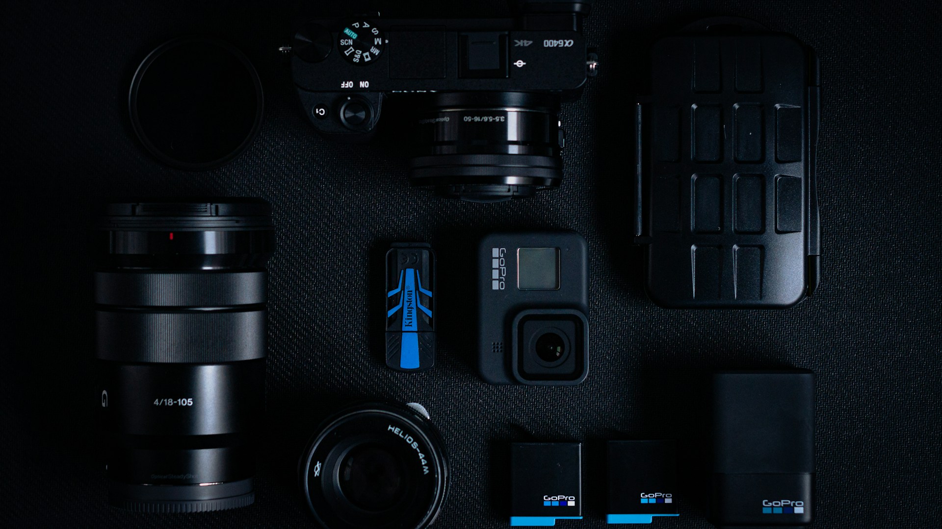 black dslr camera on black computer keyboard