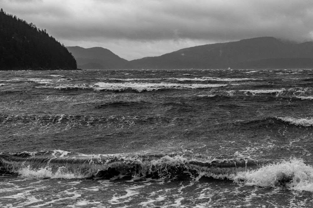 grayscale photo of water waves