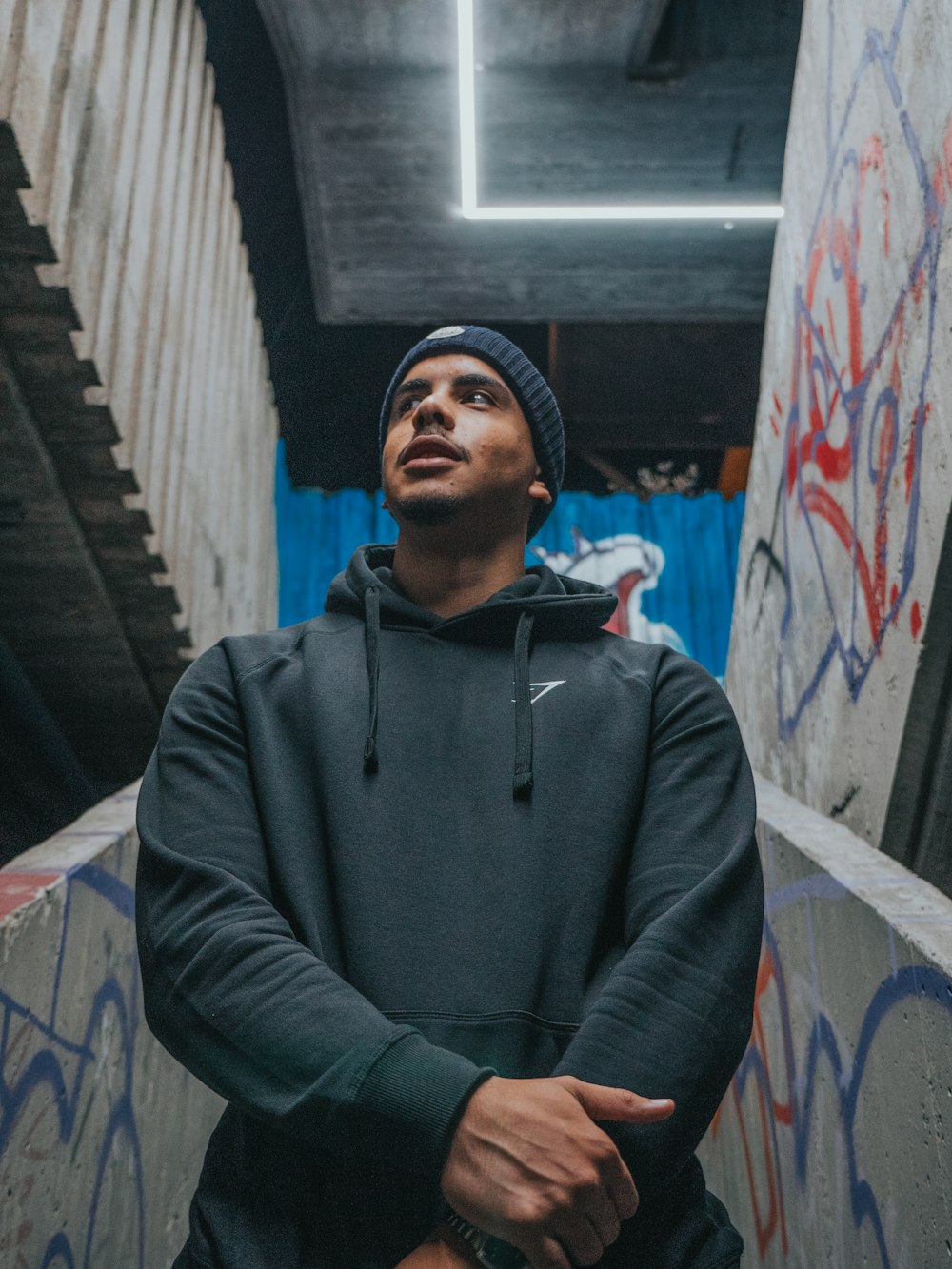 man in gray hoodie sitting on chair