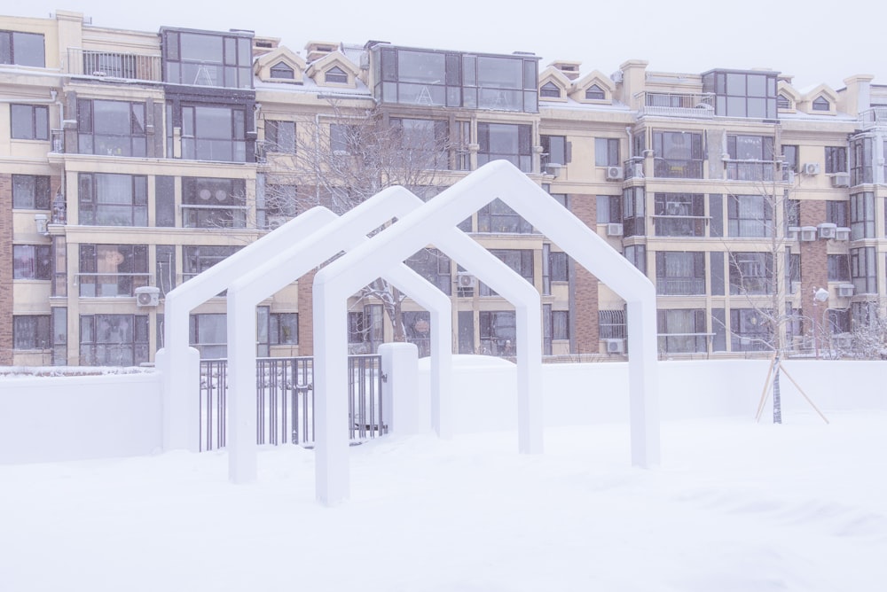 white and brown concrete building covered with snow during daytime