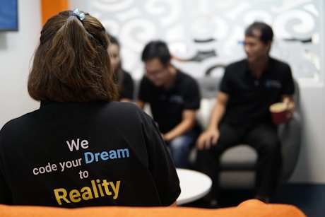 woman in black crew neck t-shirt sitting on chair