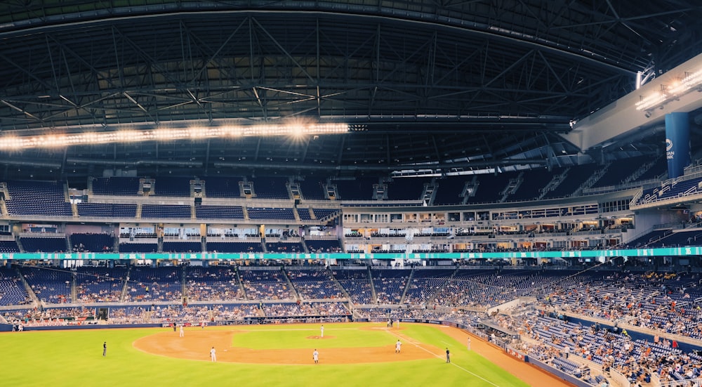 people watching baseball game during daytime