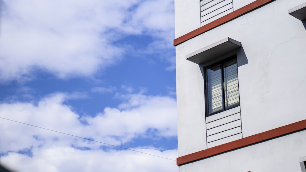 white and red concrete building under blue sky during daytime