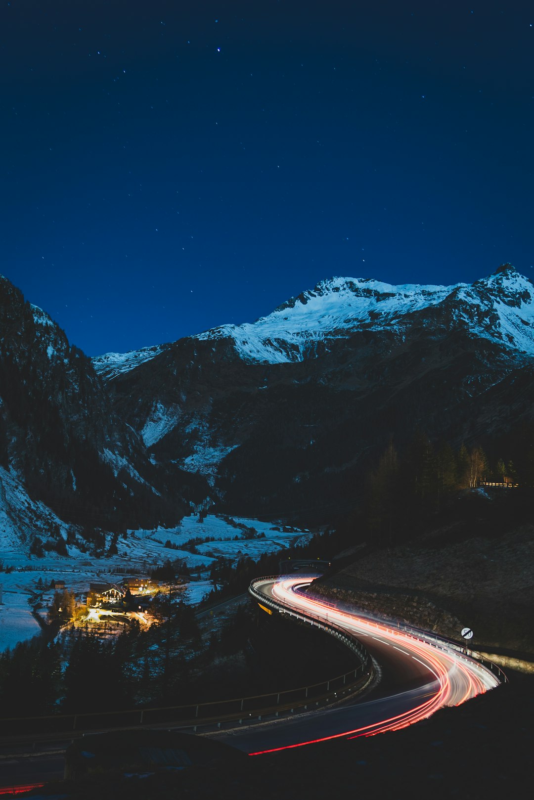 snow covered mountain during night time