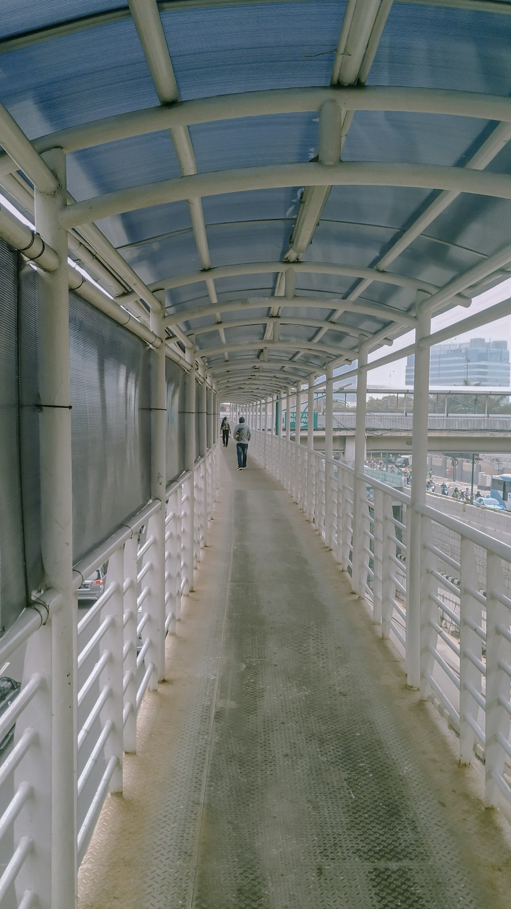 person walking on hallway during daytime