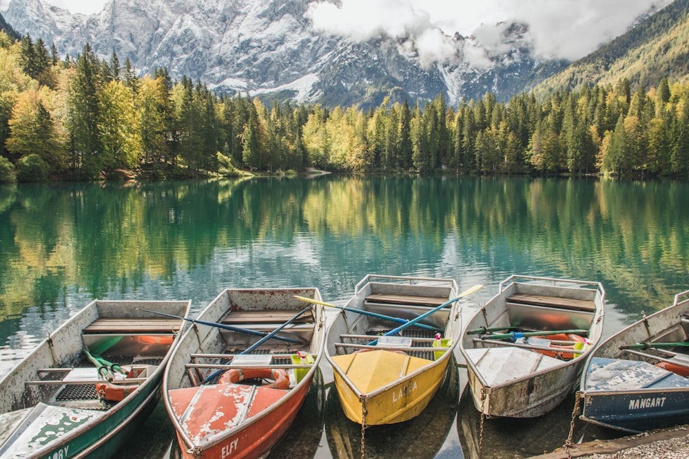 brown wooden boat on lake during daytime