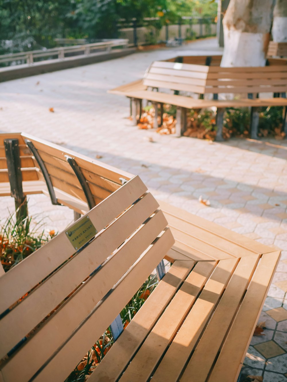 brown wooden bench on gray concrete floor