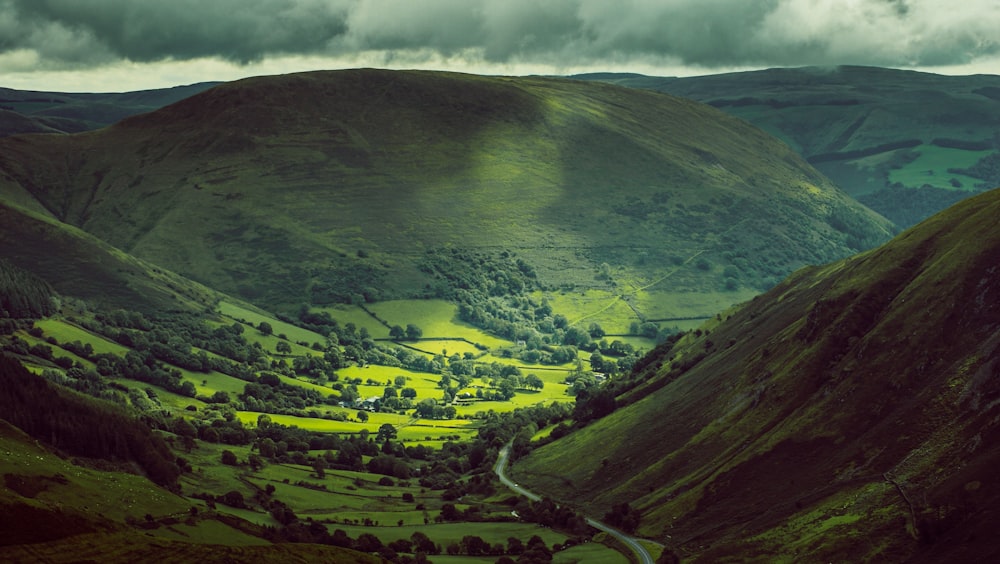 green mountains under white clouds during daytime