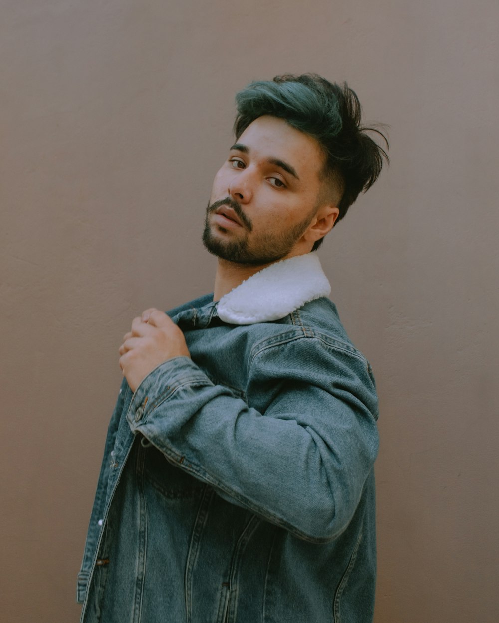 man in blue denim jacket