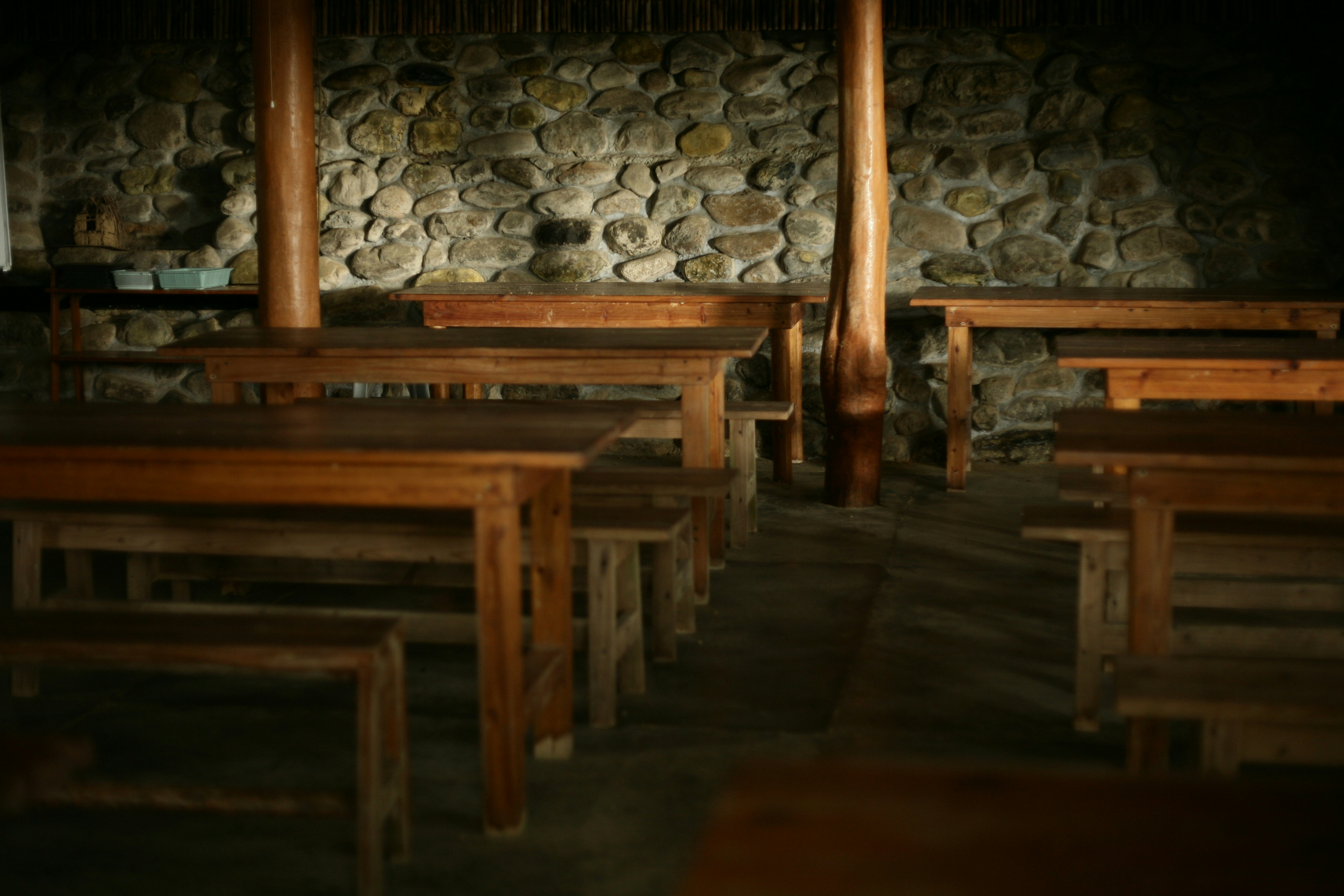 brown wooden chair on gray concrete brick floor