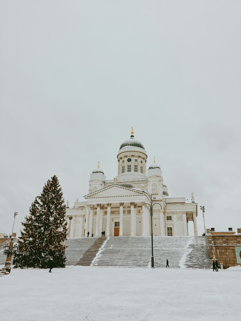 white concrete building under white sky during daytime