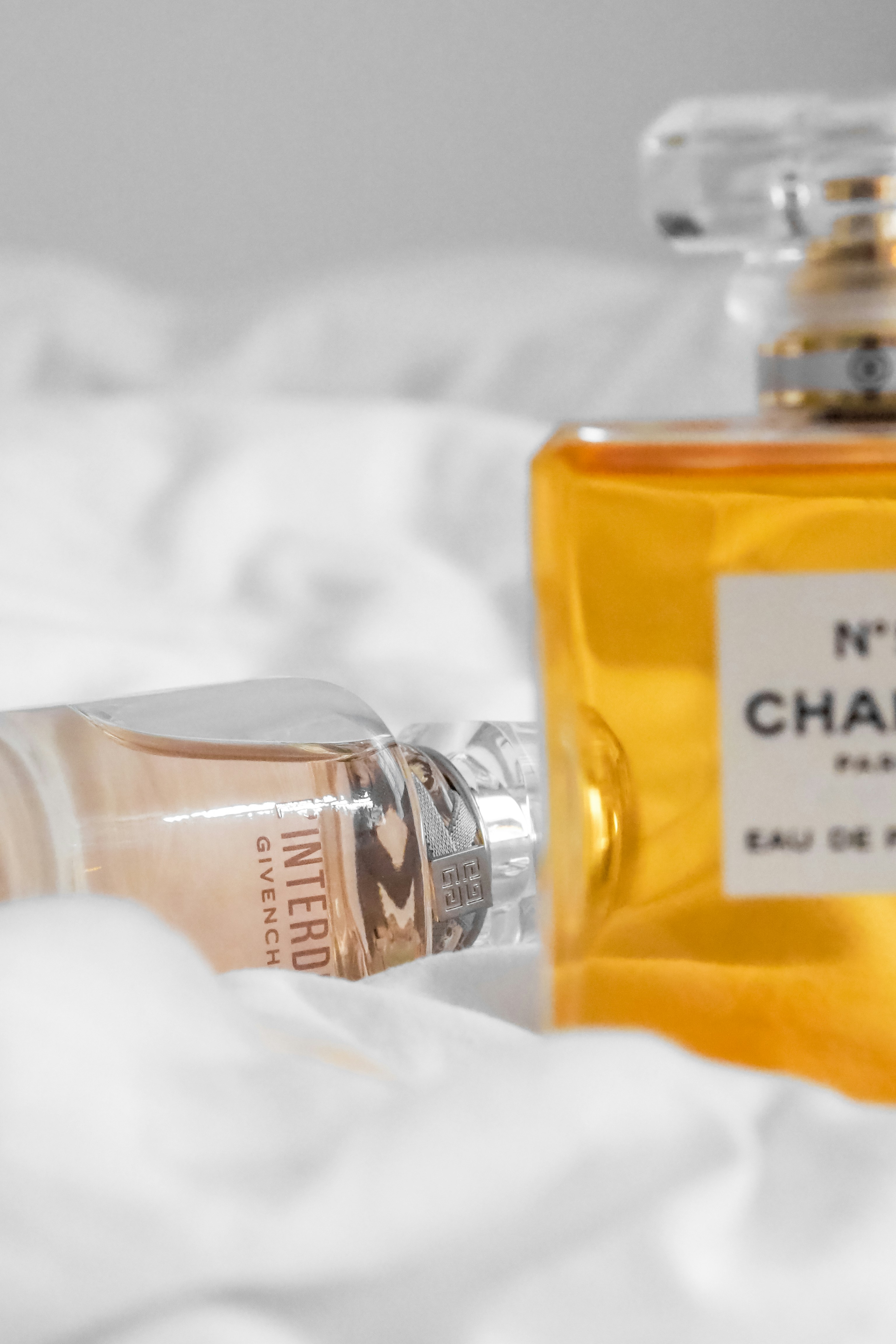 clear glass bottle with yellow liquid