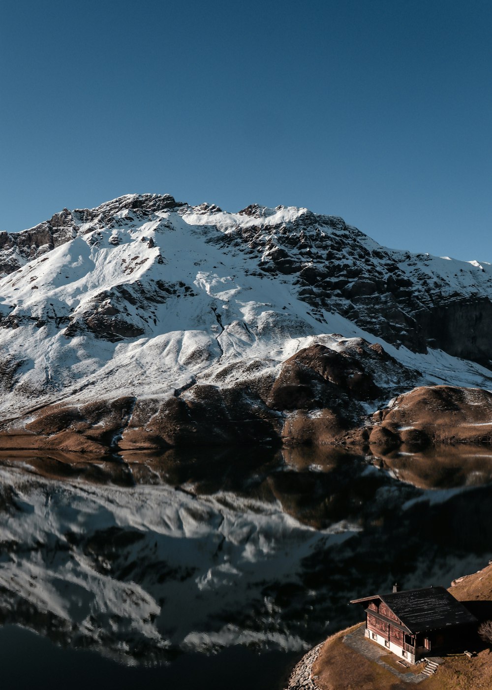 snow covered mountain under blue sky during daytime