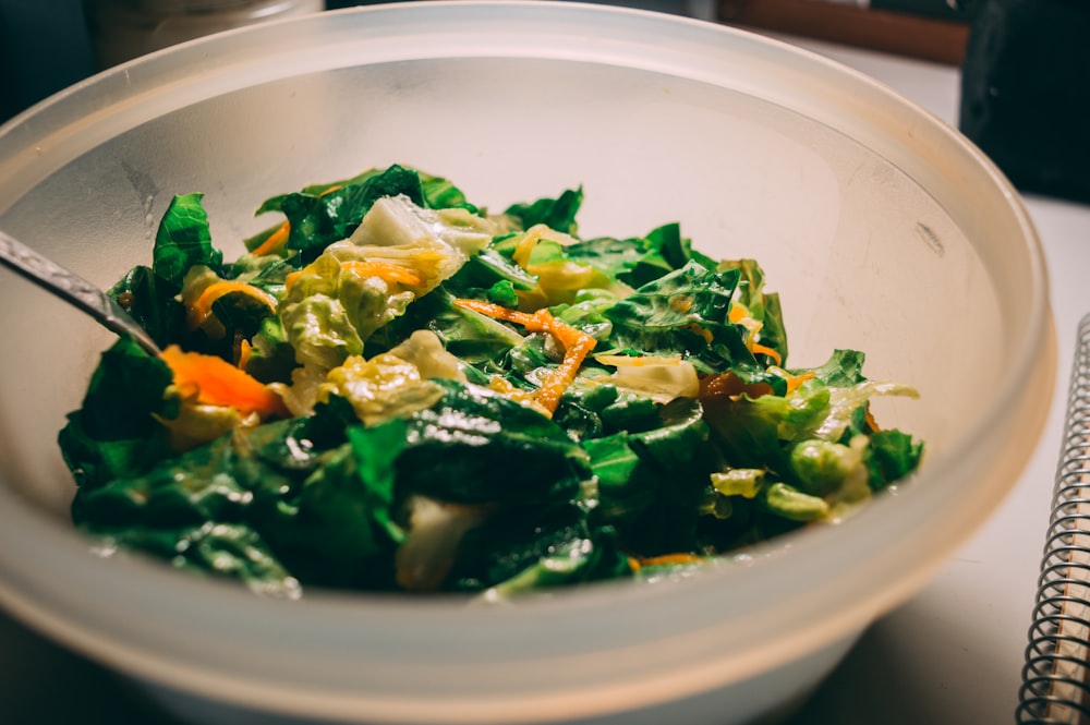 green vegetable on white ceramic bowl