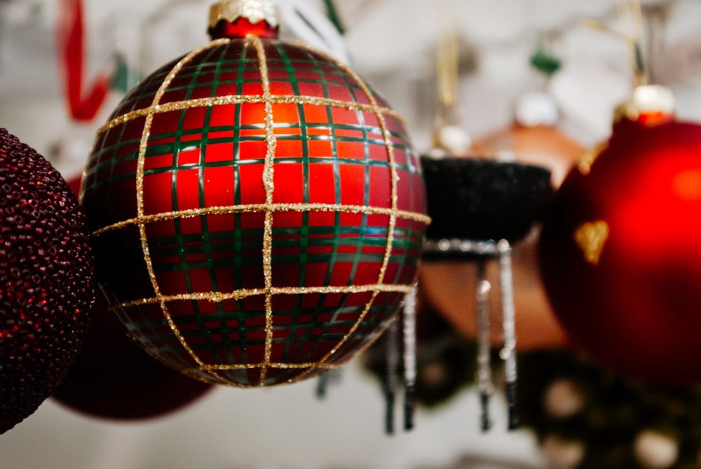 red and black ball on black metal stand