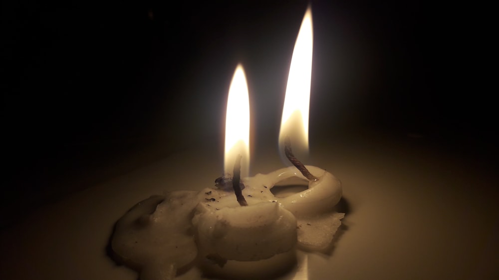 white candle on white surface