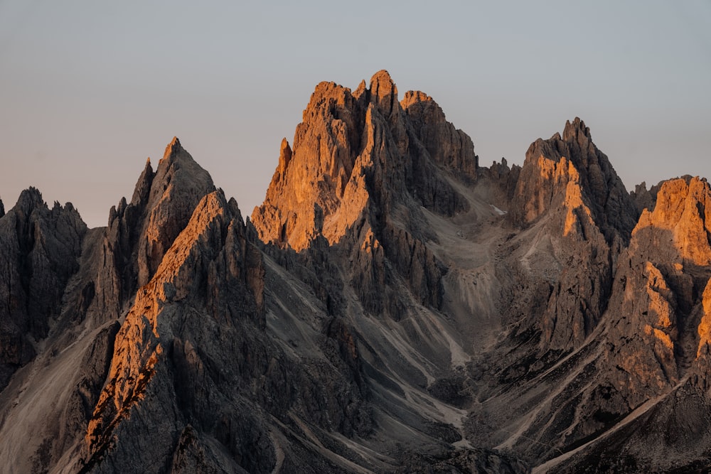 brown rocky mountain under white sky during daytime