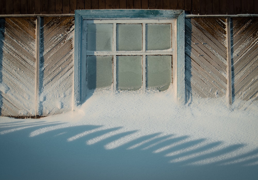 white wooden framed glass window