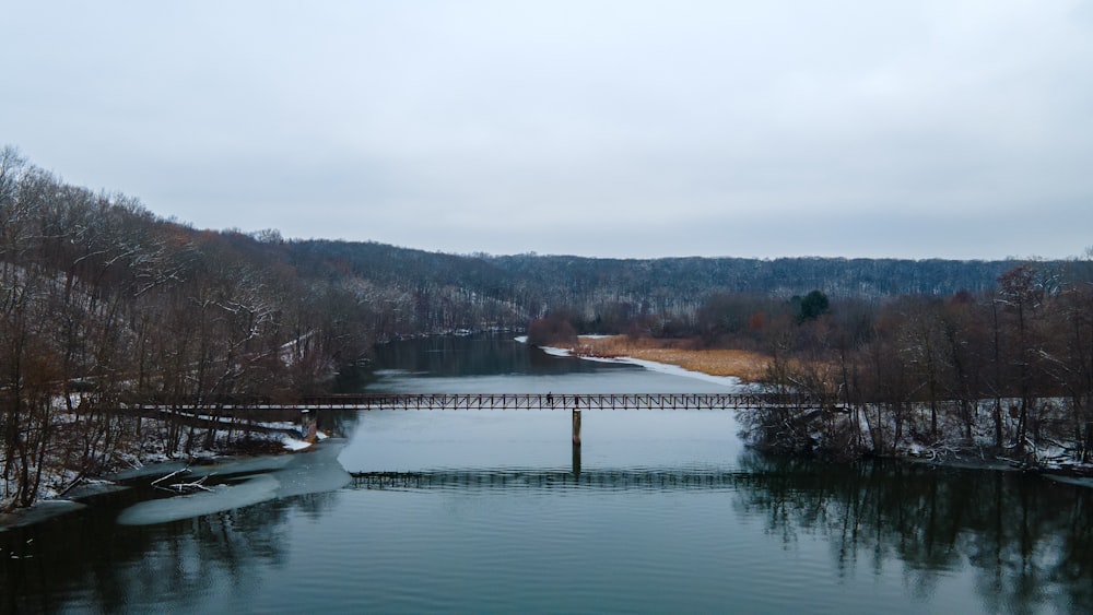 white and brown bridge over river during daytime