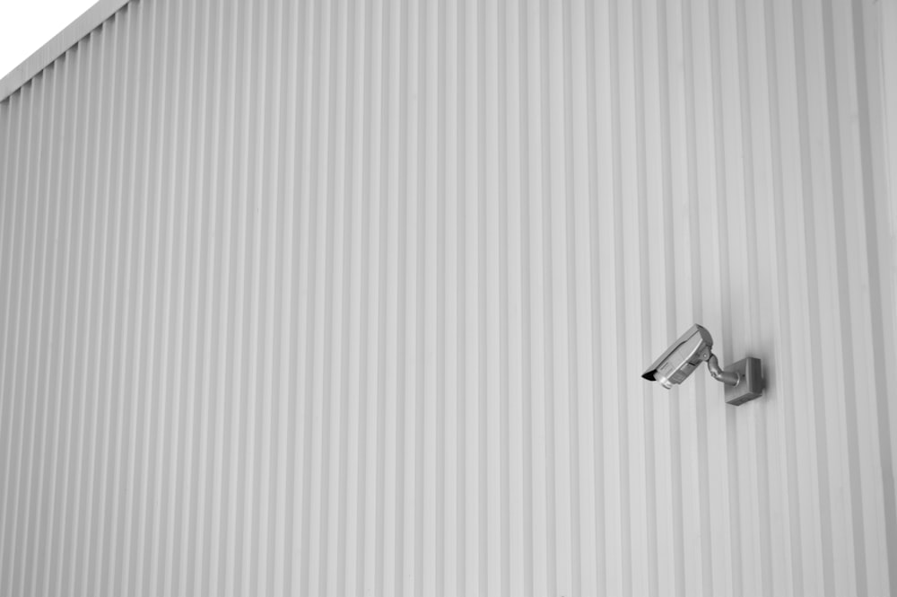 silver key on white and blue striped paper