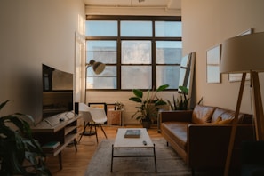 A cozy living room with natural light and modern decor.