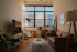 Cozy living room with natural light highlighting elegant, functional furniture.