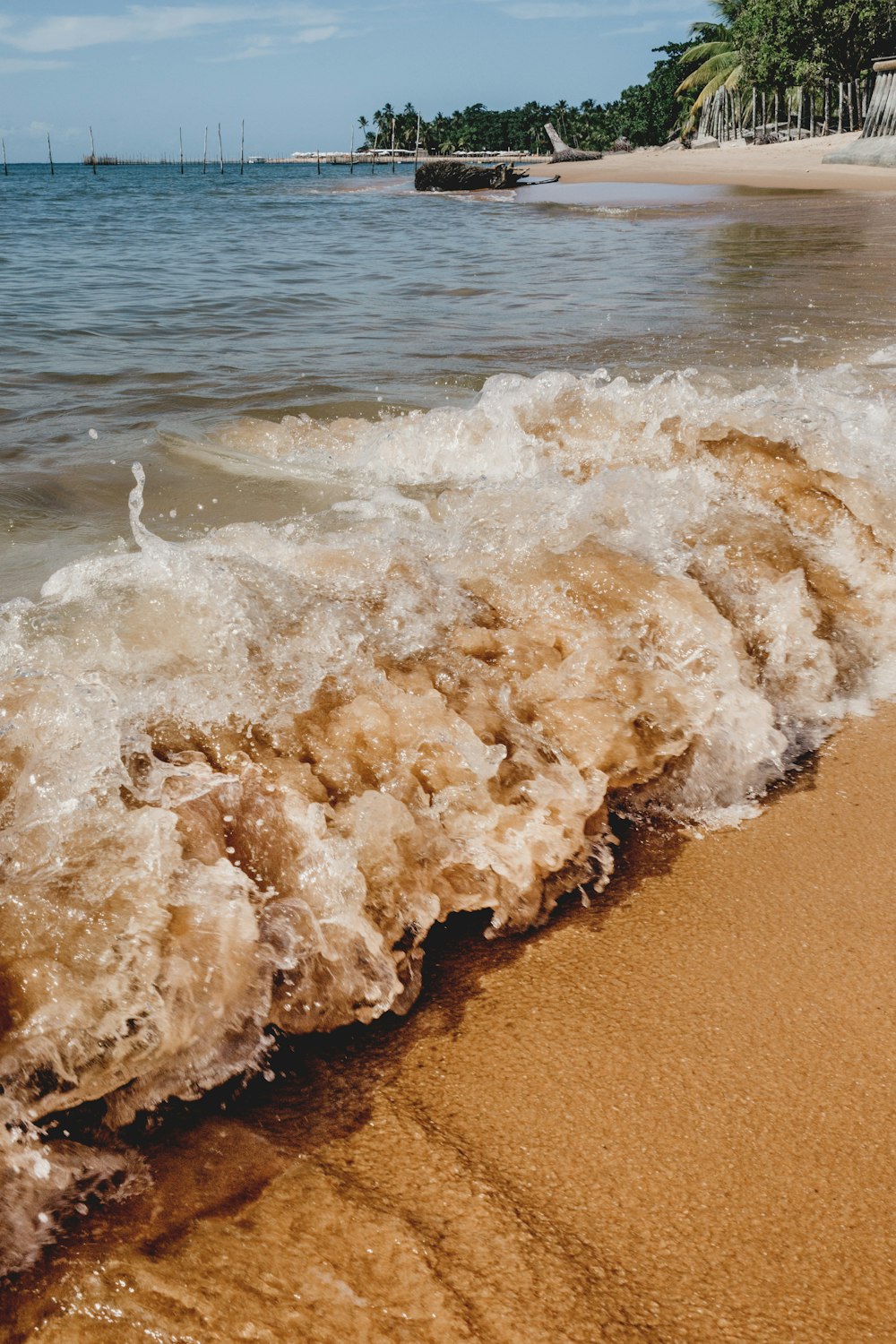 brown sand on beach during daytime