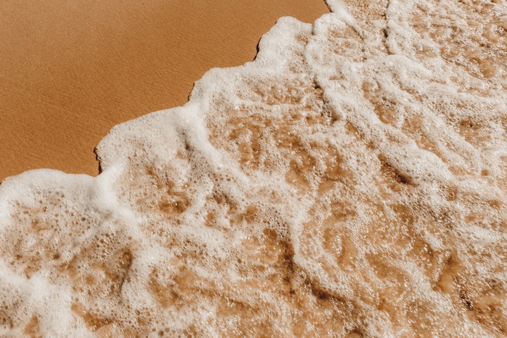 white sand on brown surface
