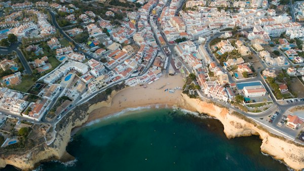 Aerial view of city buildings near body of water during daytime — Algarve, Portugal