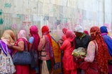 A group of friends painting the tiranga on a wall, capturing the spirit of unity.