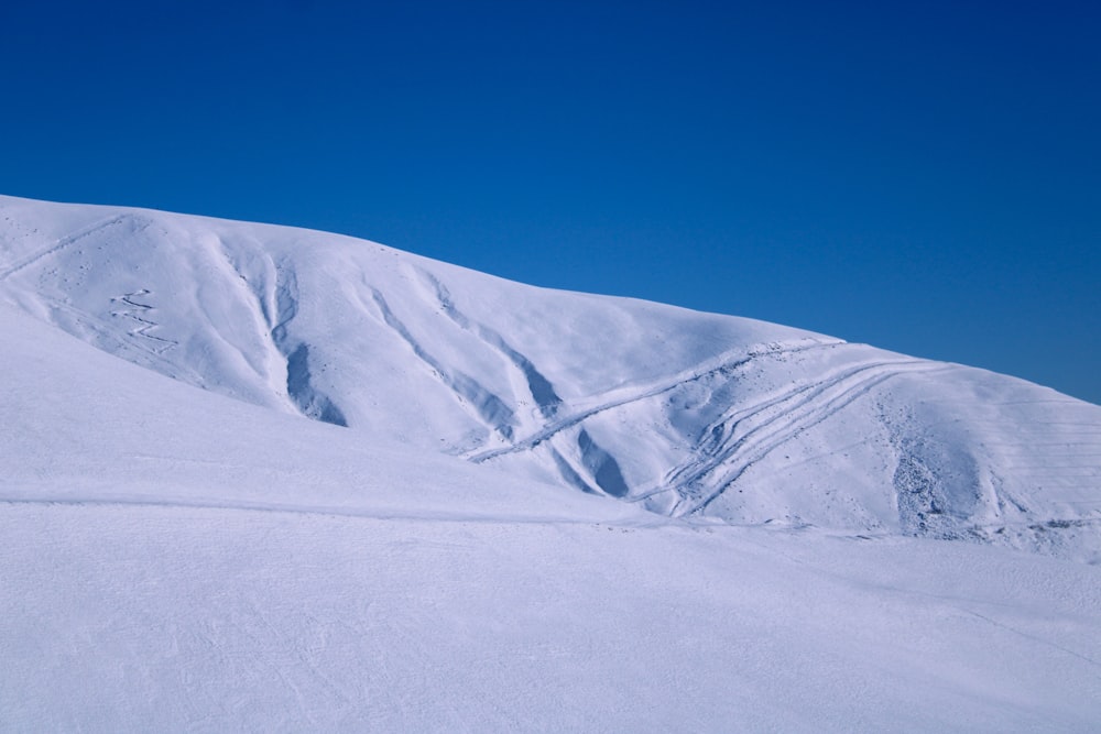 snow covered mountain under blue sky during daytime