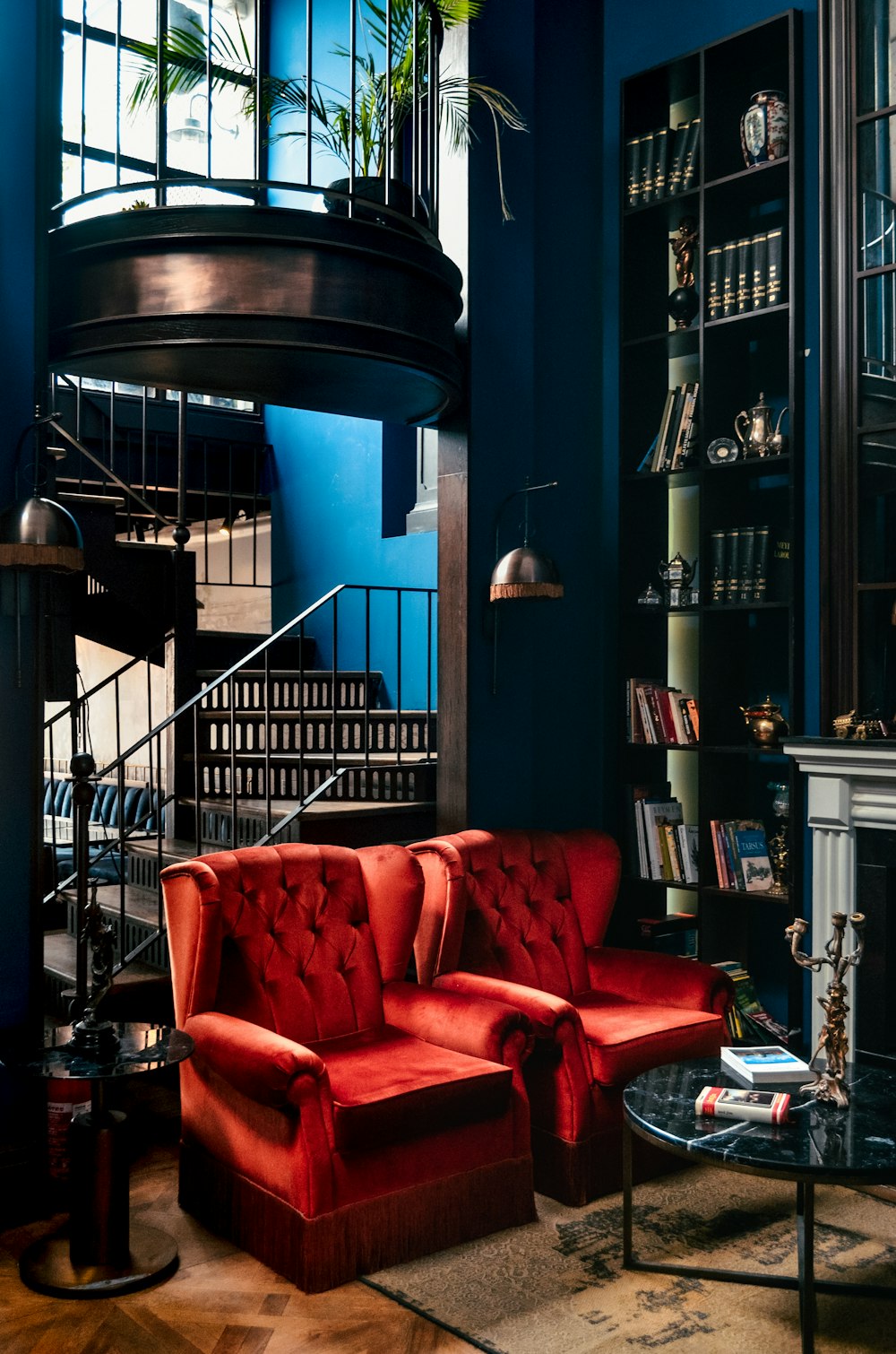 red leather sofa chair near black wooden table