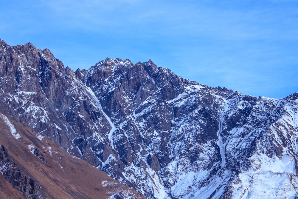 snow covered mountain under blue sky during daytime