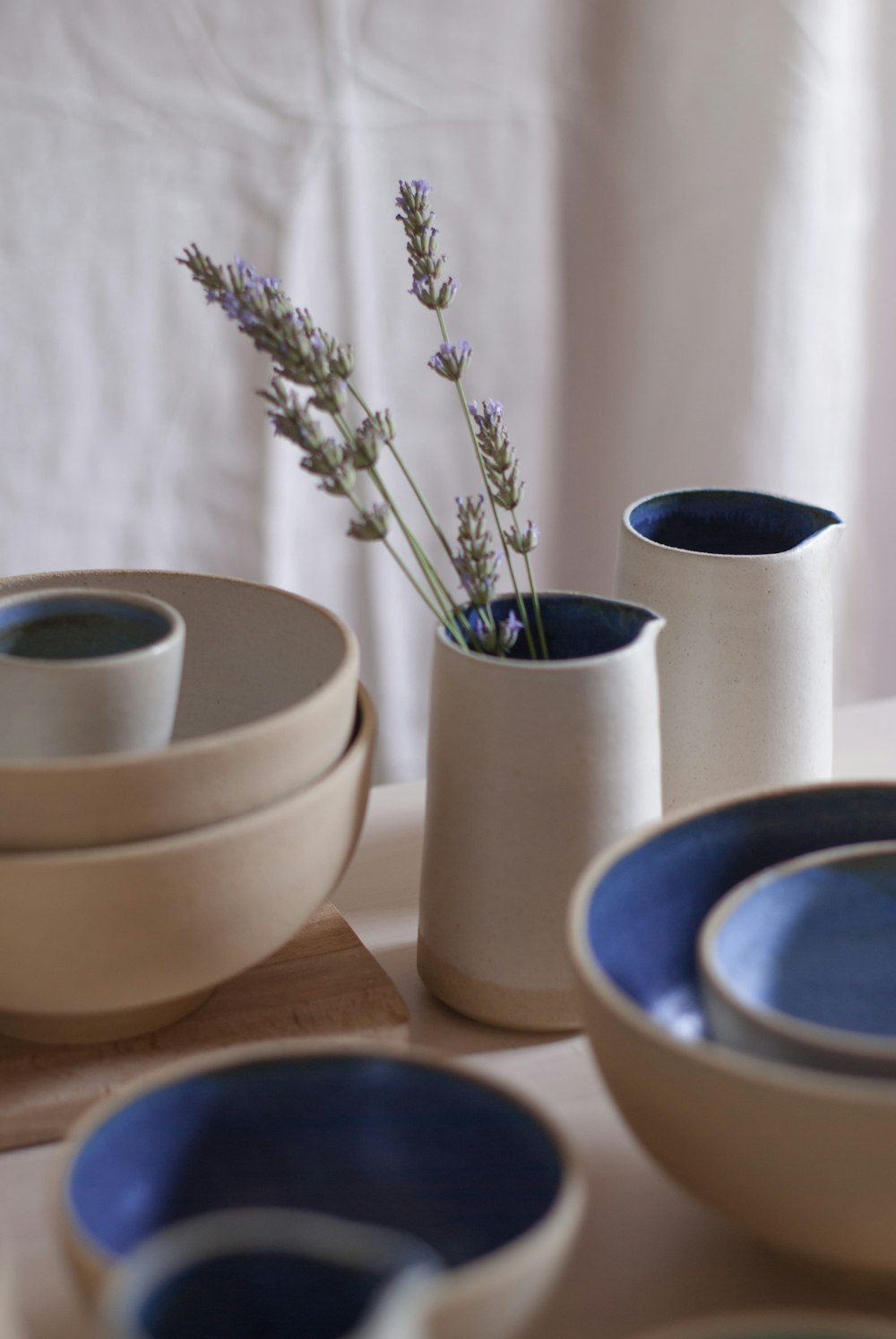 white ceramic bowl on brown wooden table