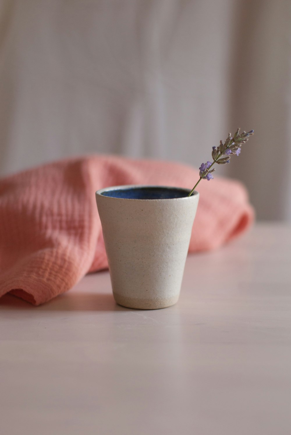 white ceramic flower vase on white table