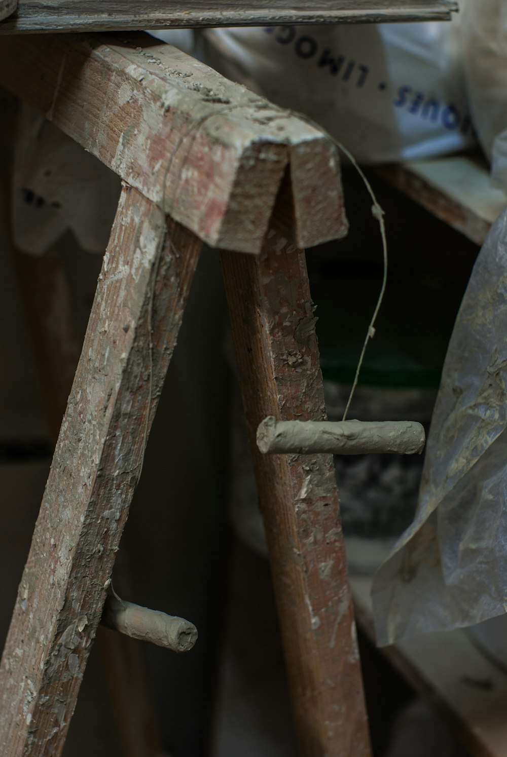 a close up of a piece of wood on a ladder