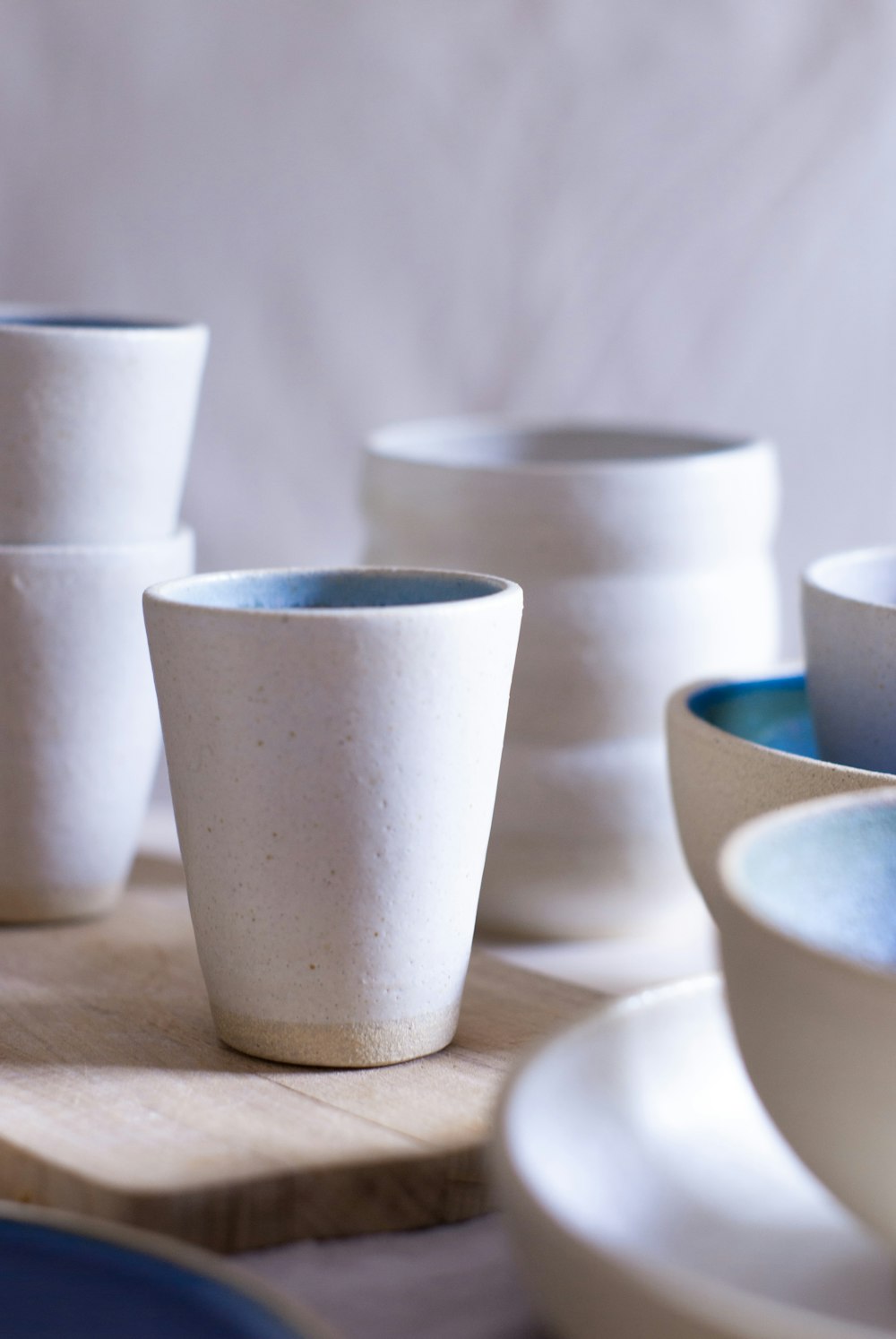 white ceramic cup on table