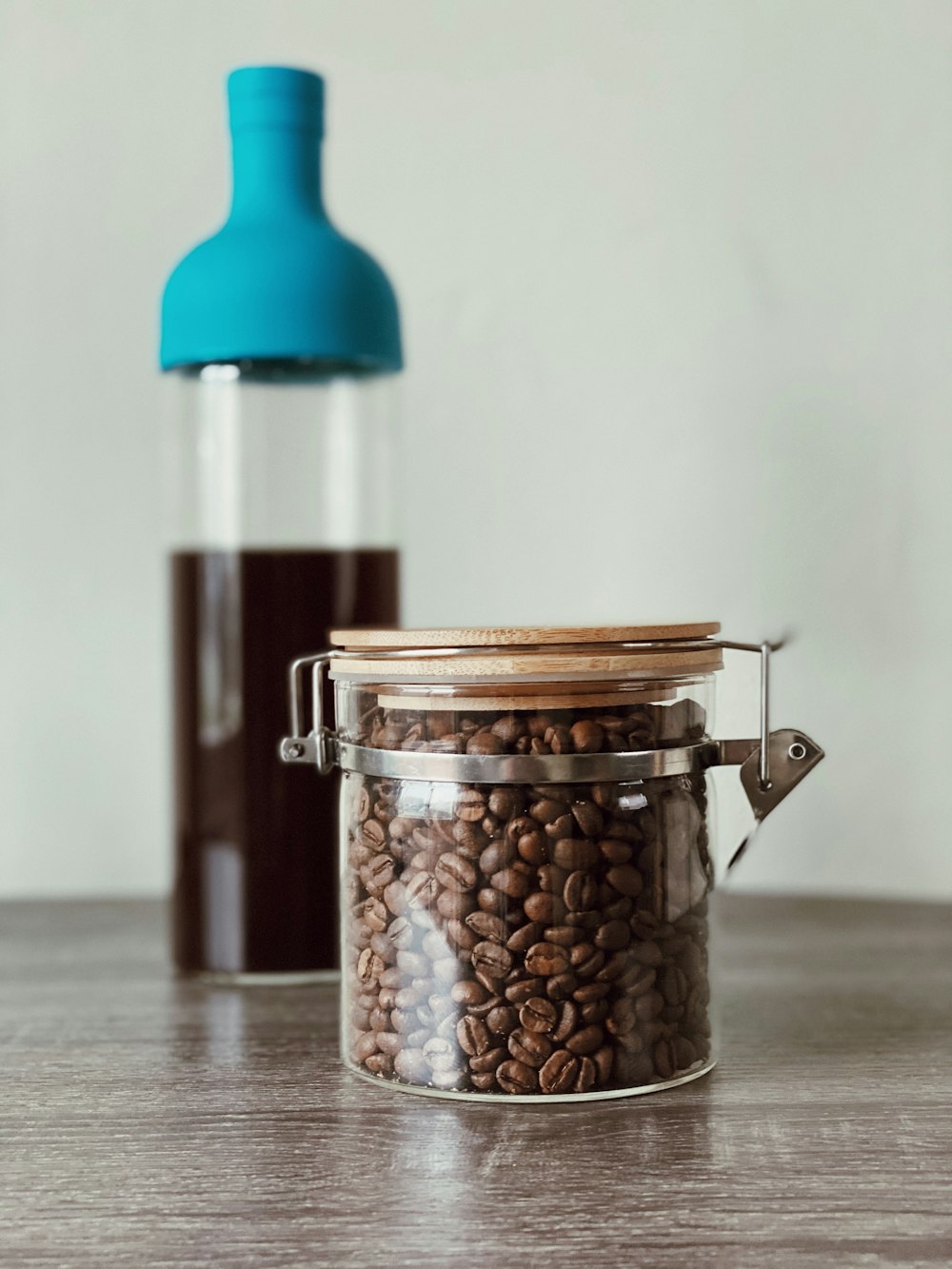 clear glass jar with brown and white beads