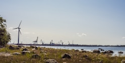 brown wooden dock on sea under blue sky during daytime