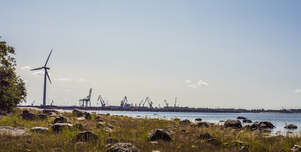 brown wooden dock on sea under blue sky during daytime