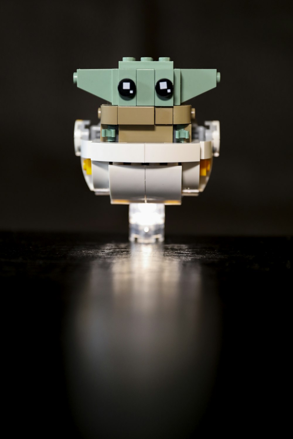 green and white robot toy