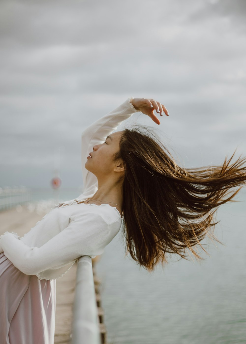 woman in white long sleeve shirt