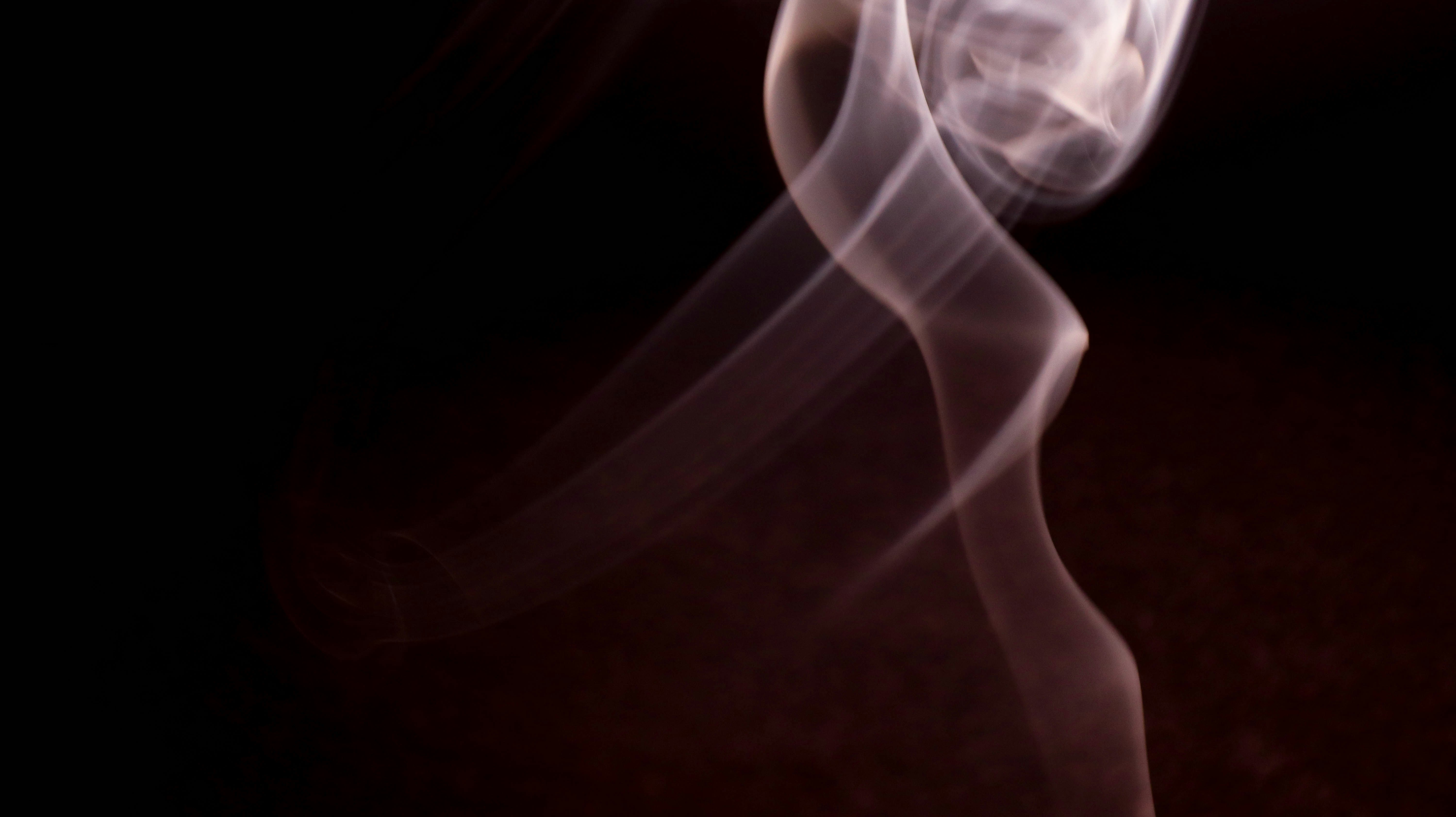 white smoke in a dark room