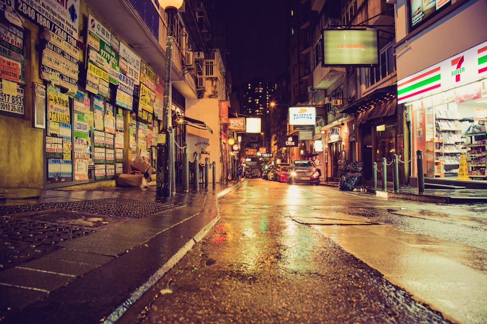 empty street with lighted street lights during night time