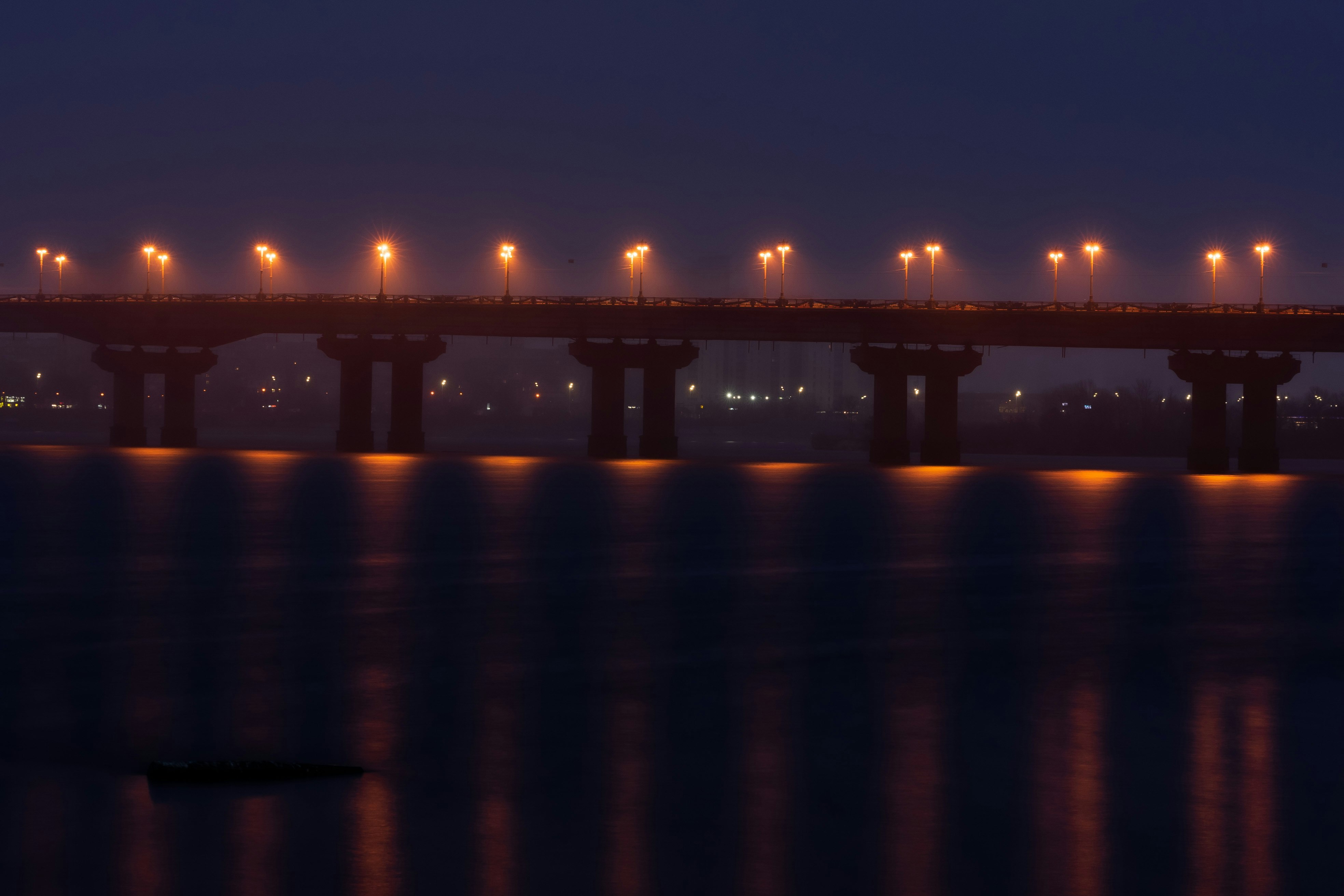 bridge over the water during night time